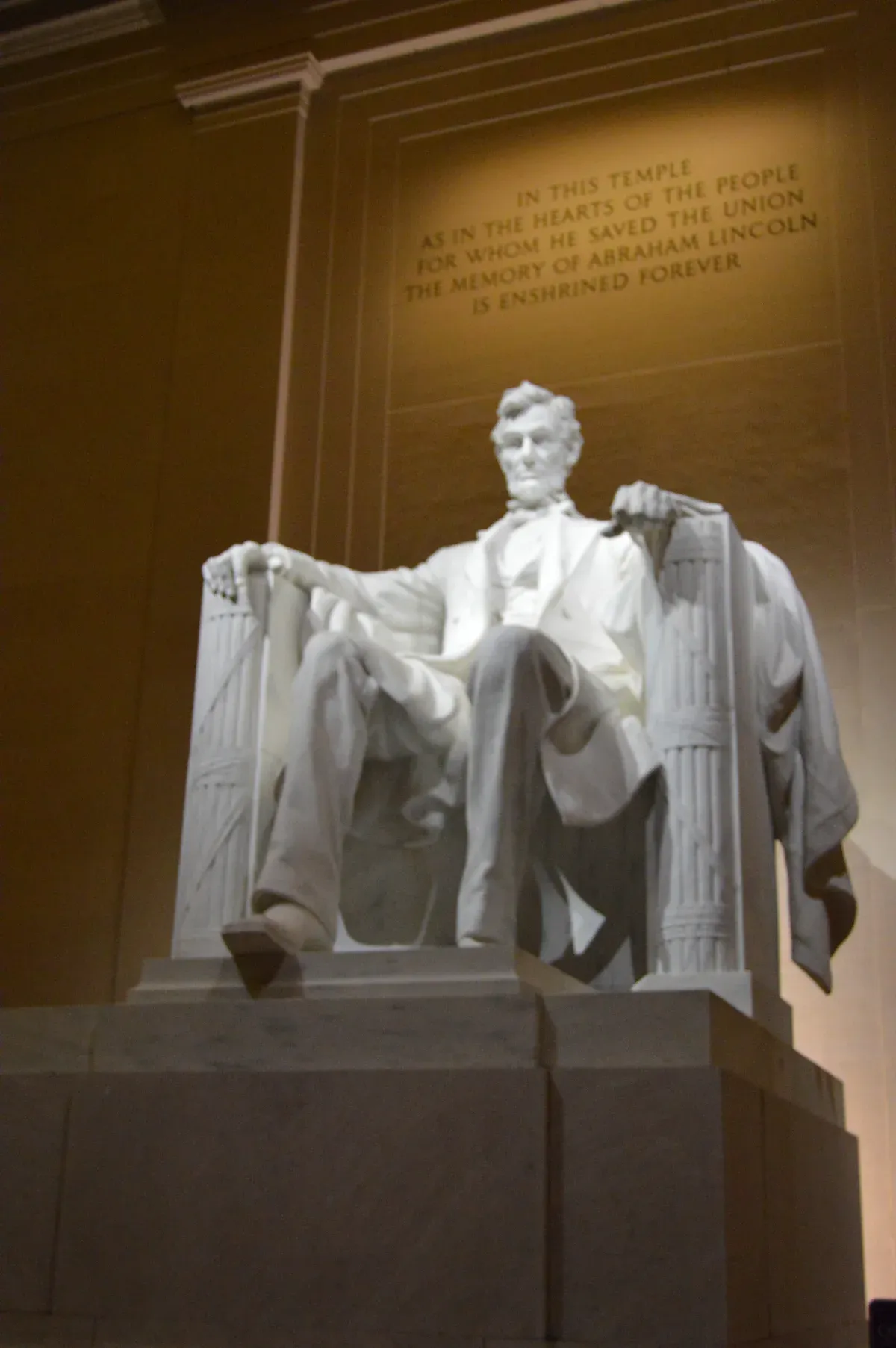 The Lincoln statue lit inside the Lincoln Memorial at night, seen on a Washington DC tour for seniors at night